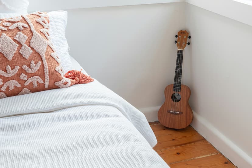 Closeup of an instrument leaning against a wall